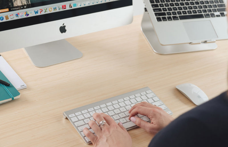person typing on mac