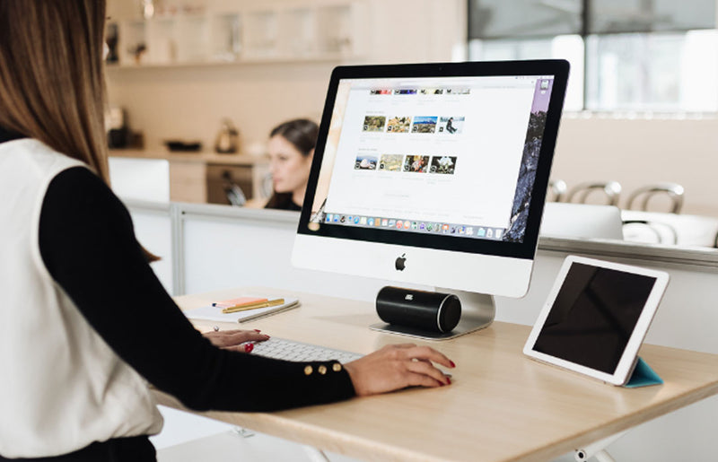 woman using computer at standing desk