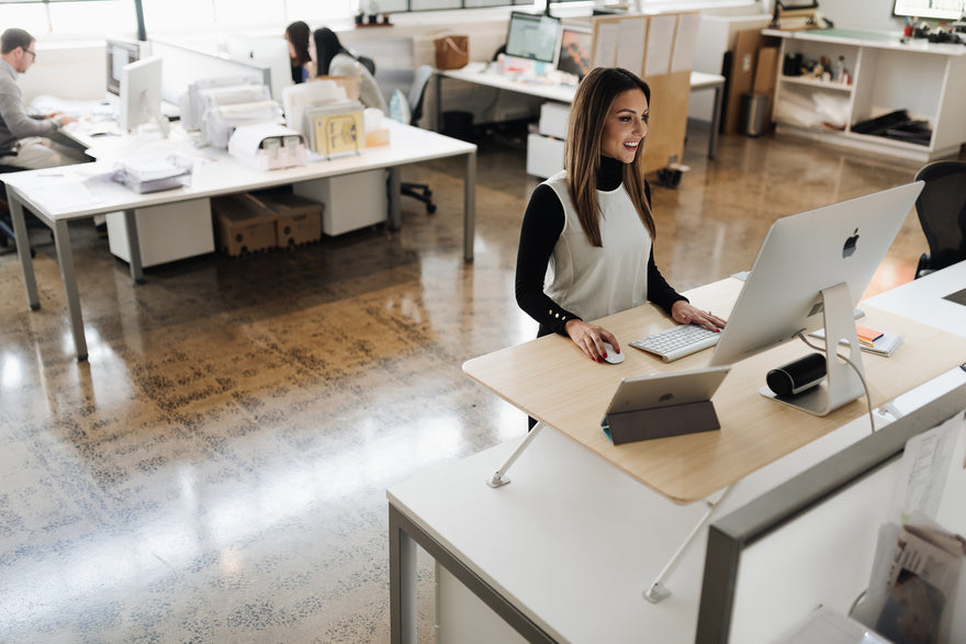 woman in office at standing desk